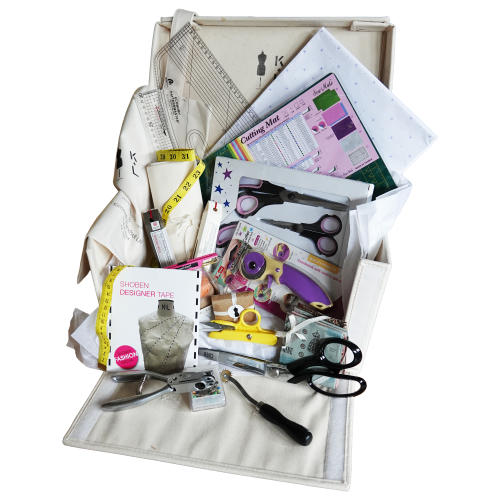 Kennett and Lindsell Kit One Student Staples fashion design toolkit showing tailor shears, pattern master, cutting mat, and calico fabric.