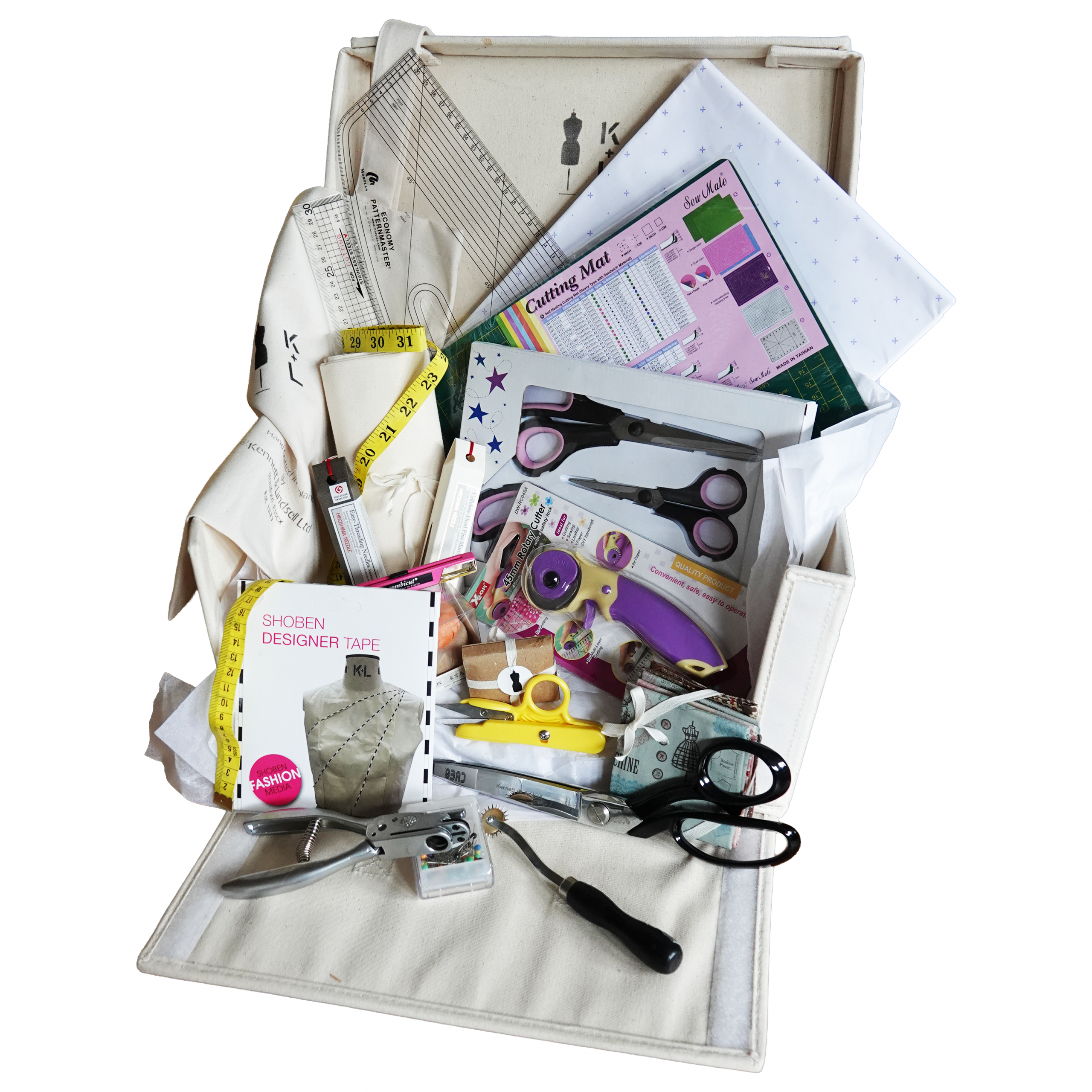 Kennett and Lindsell Kit One Student Staples fashion design toolkit showing tailor shears, pattern master, cutting mat, and calico fabric.